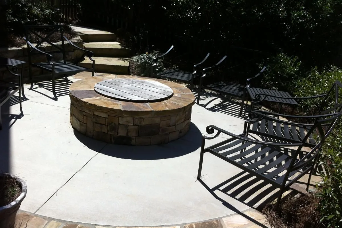 Paver patio and stone retaining wall in a North Atlanta backyard