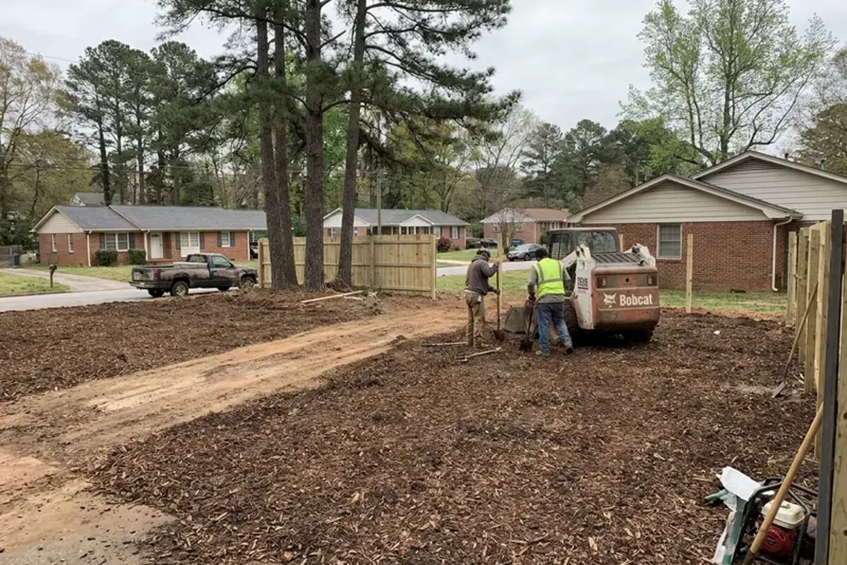Cleared and graded lot with woodchip ground cover