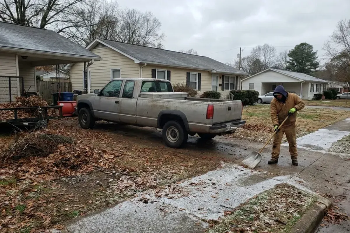 Plow truck clearing a commercial lot