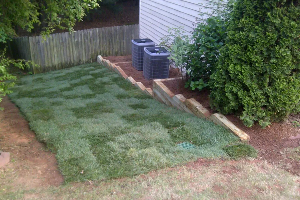 Fresh sod rolls installed by the 4 Seasons crew