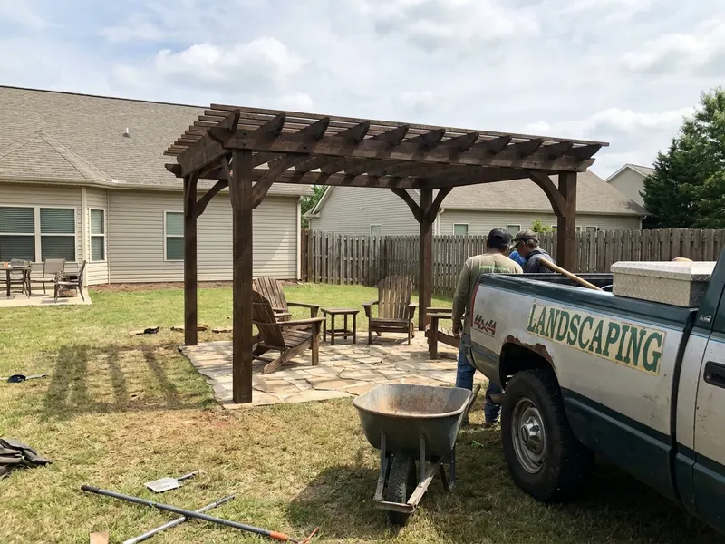 Stained pergola with outdoor seating beneath