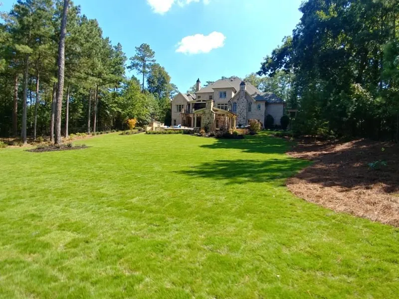 Curved hedge and shrub plantings by 4 Seasons in the North Atlanta metro