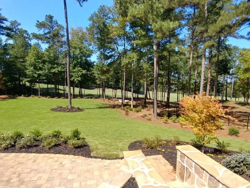 Open lawn and planting beds by 4 Seasons in the North Atlanta metro