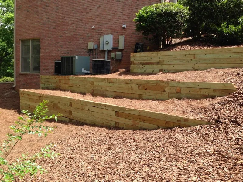 Retaining wall with planted slope by 4 Seasons in the North Atlanta metro