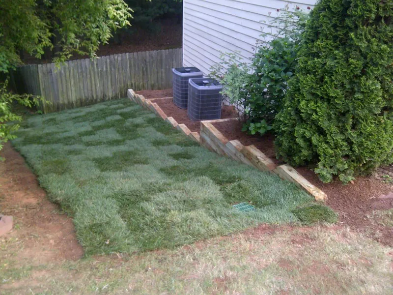 Sod rolls being installed by 4 Seasons in the North Atlanta metro