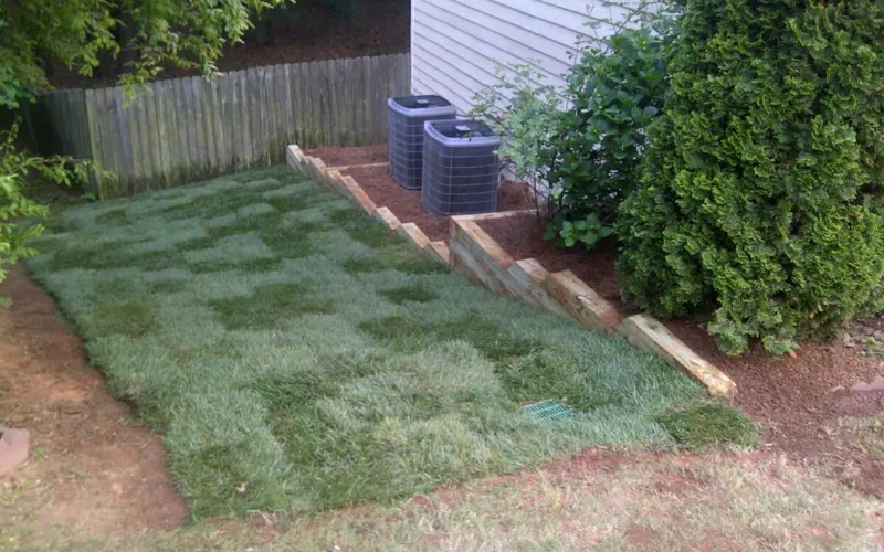 Fresh sod rolls being installed by the 4 Seasons crew
